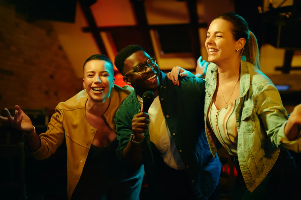 cheerful-african-american-man-singing-karaoke-with-2023-11-27-05-14-07-utc